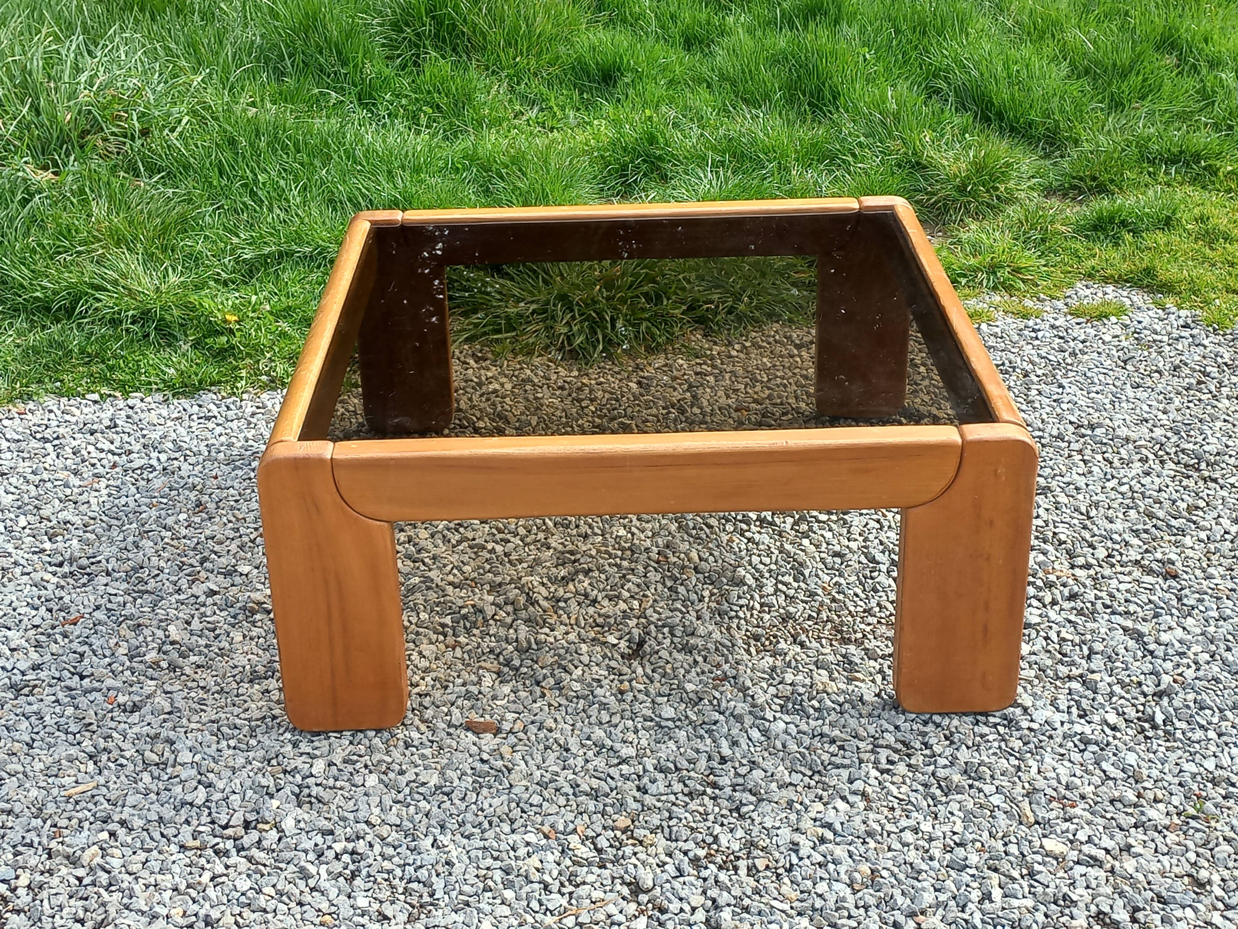 Coffee table from Regain in solid elm with a smoked glass top.