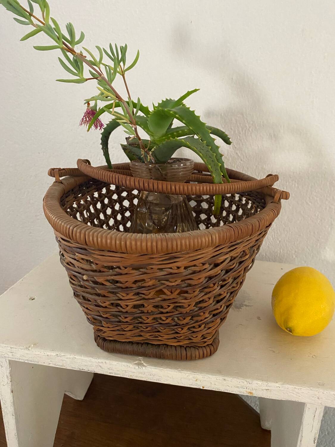 Vintage wicker and cane basket in bohemian style