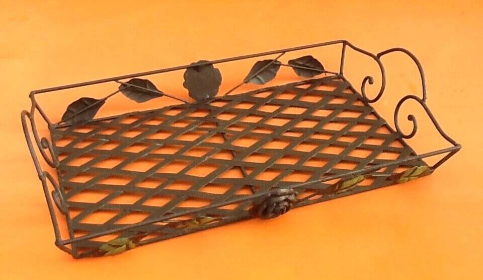 Rectangular metal serving tray with floral decoration.