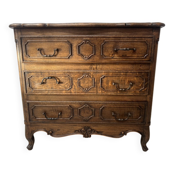Commode de style Régence en chêne sculpté XX siècle