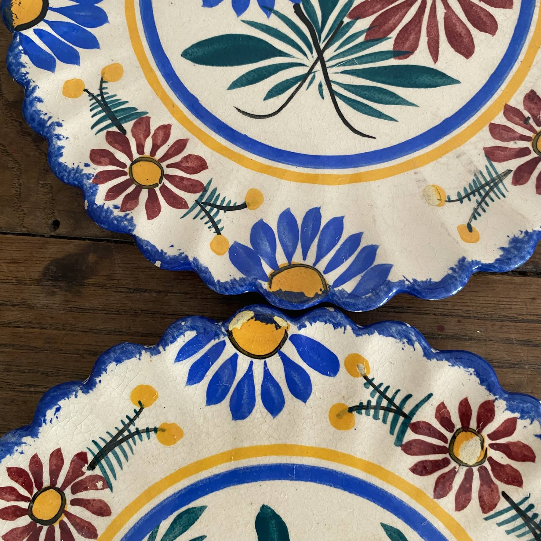 Henriot Quimper dessert plates, hand-painted earthenware.