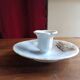 Antique handheld candle holder in porcelain
