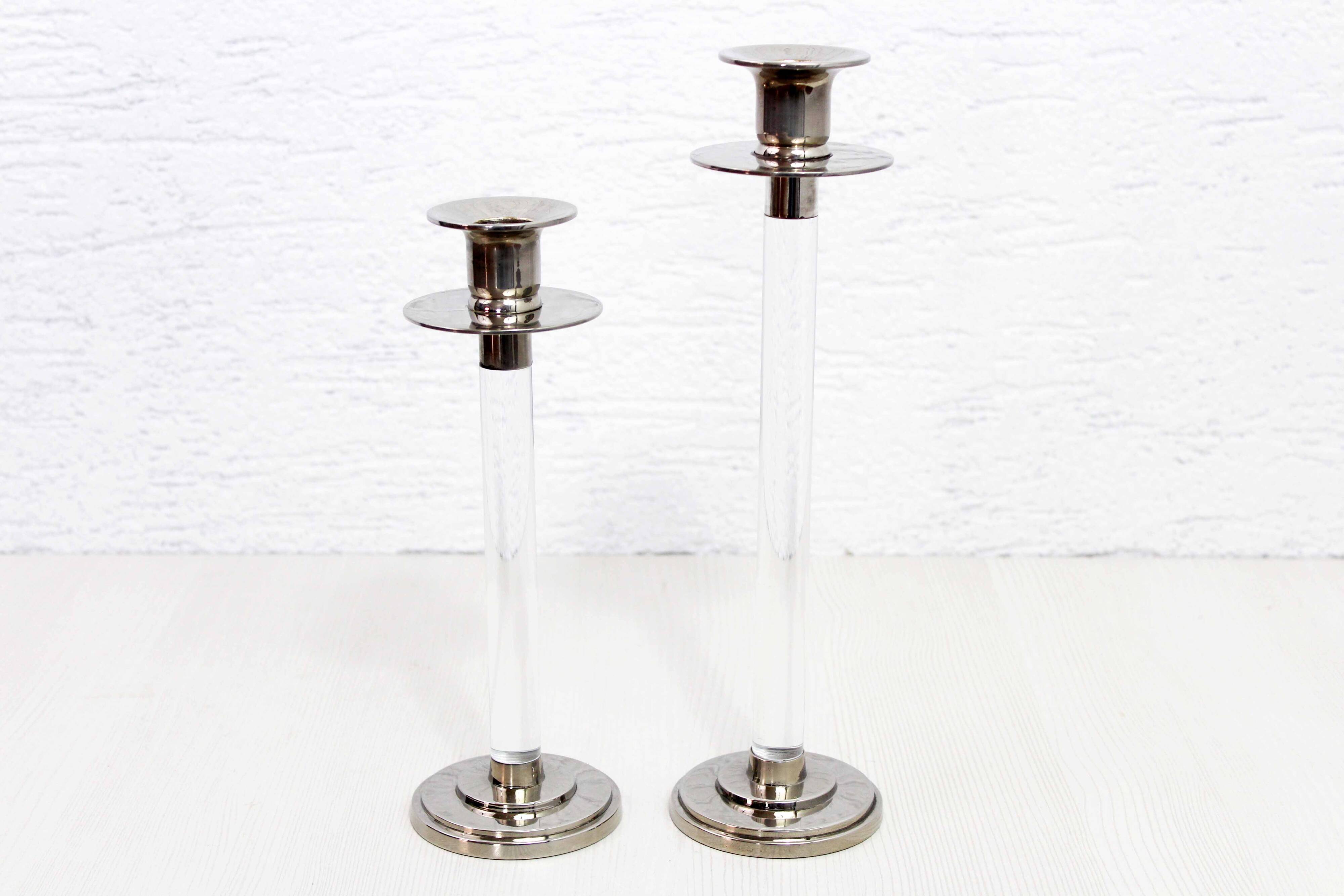 Pair of lucite and silver-plated metal candlesticks