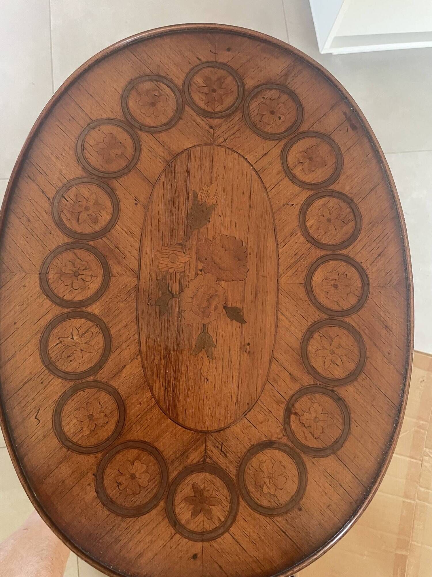 Oval bedside table from the Transition period in marquetry and bronze.