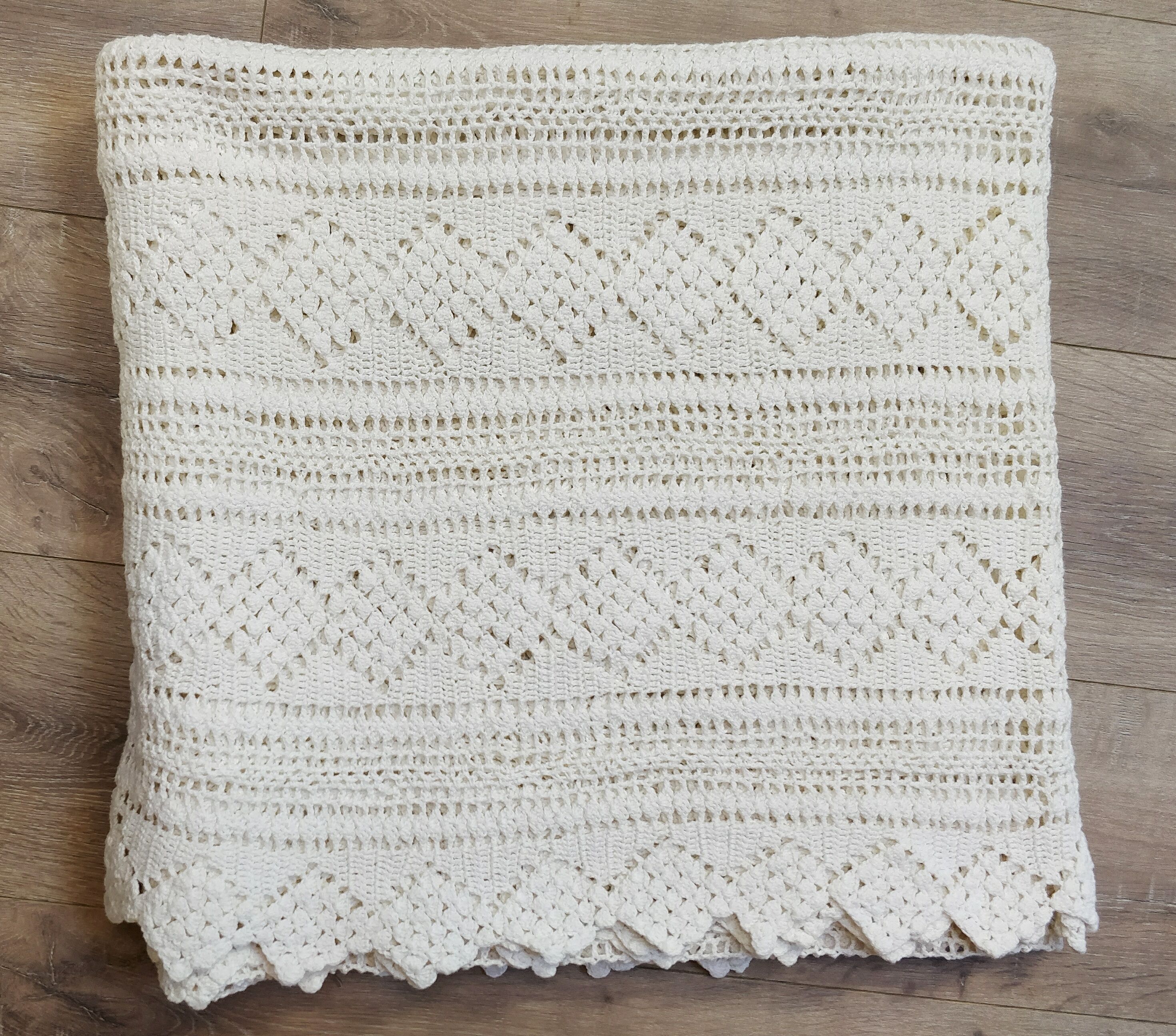 White two-seater crocheted bed top
