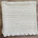 White two-seater crocheted bed top