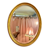 Miroir Deknudt ovale cadre doré.