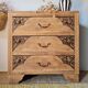 Art Deco chest of drawers in raw oak with carved drawers.