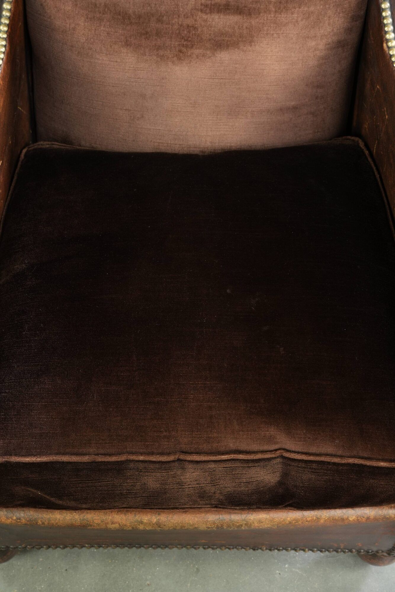 Art Deco design armchair finished in velvet and fitted with decorative nails