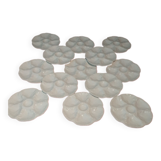 Set of 13 oyster plates in faience of Gien