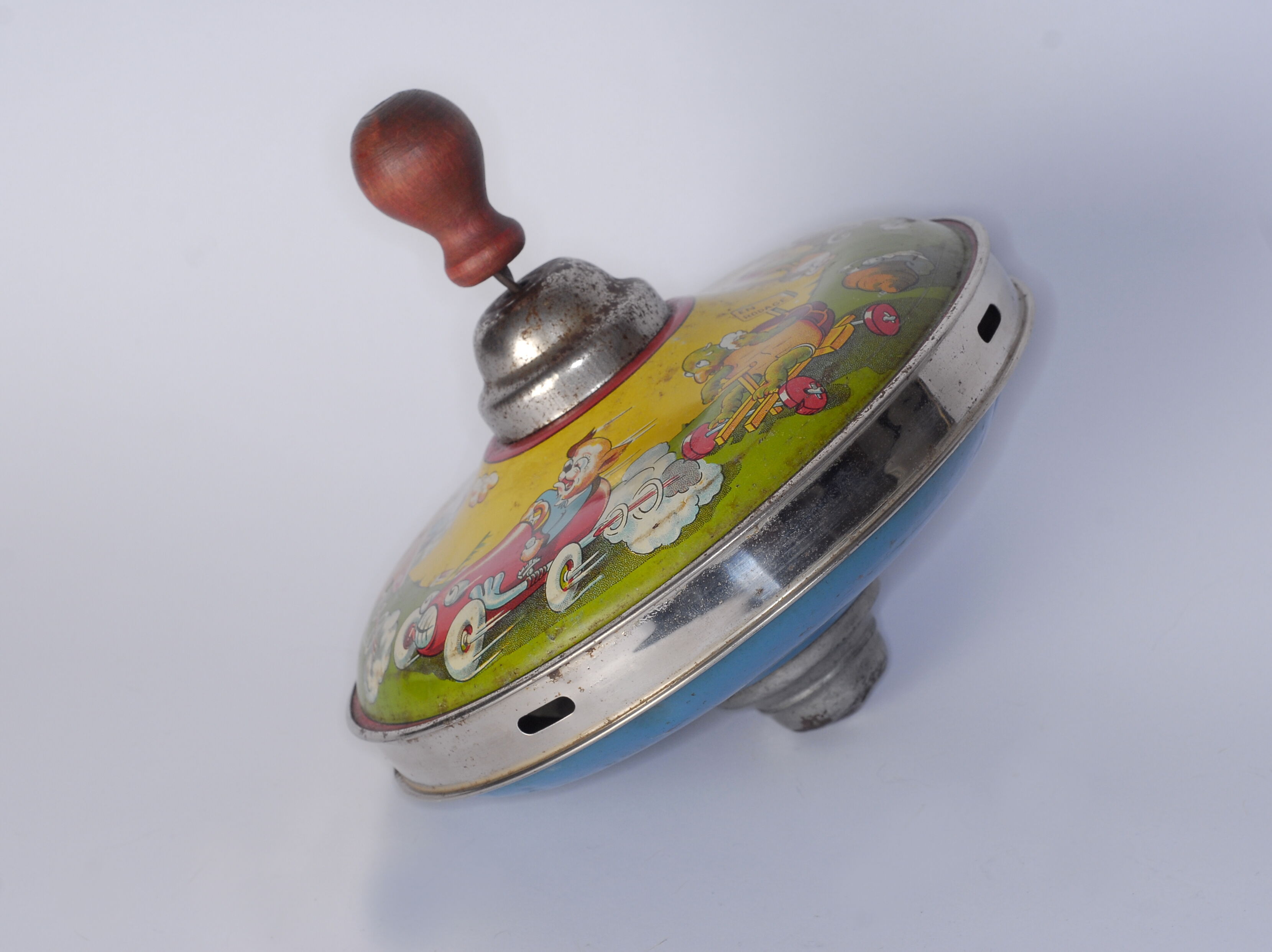Old lithographed spinning top dating from the 1930