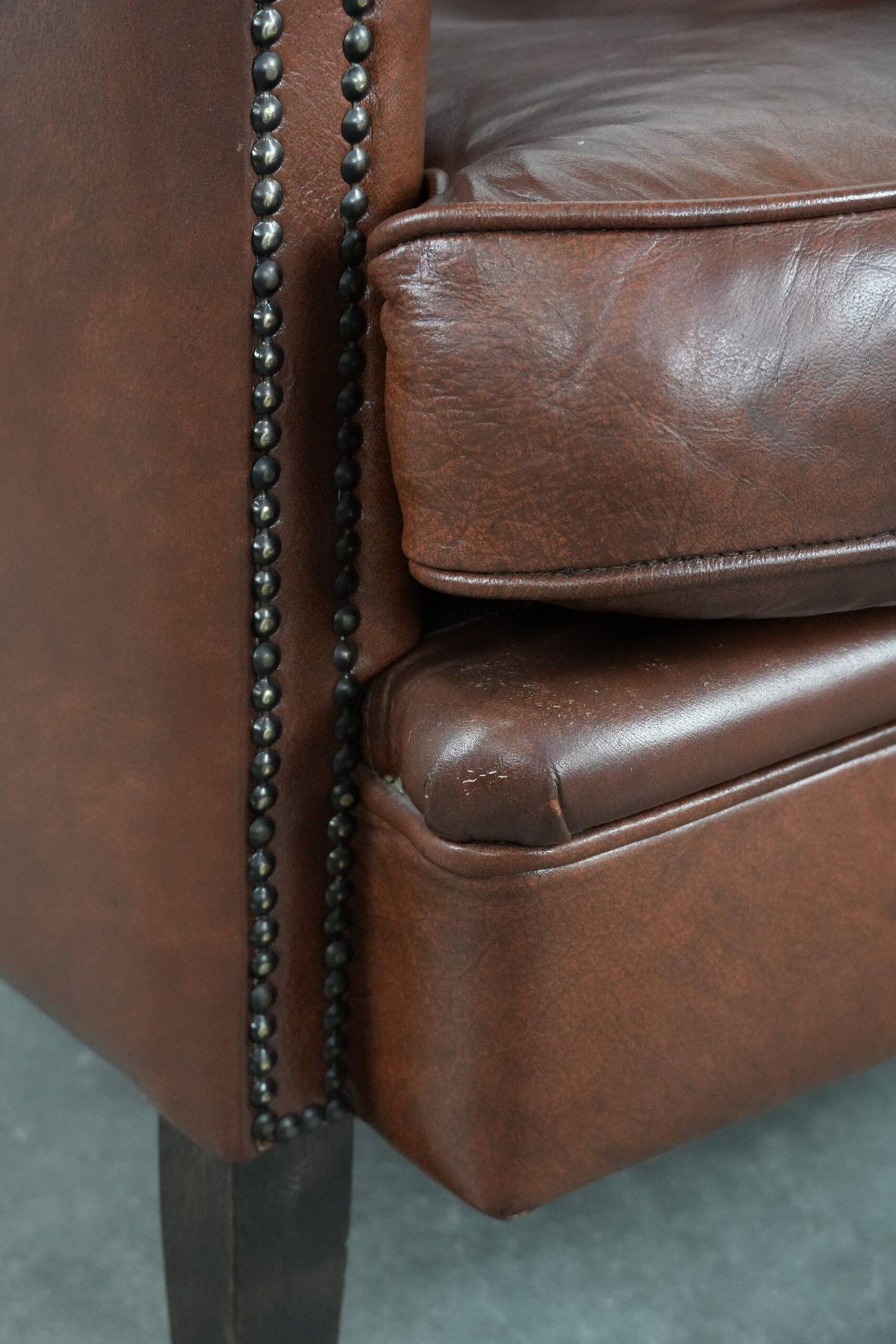 Cognac-coloured cow leather club armchair in English style