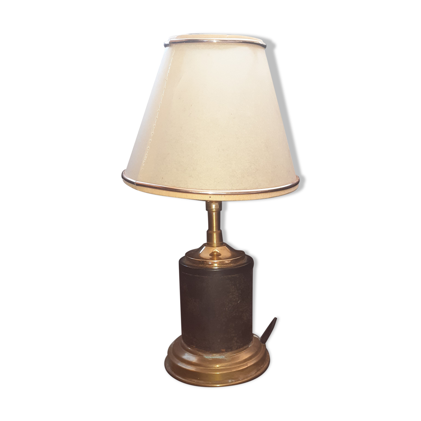 Antique lamp in black and gold metal with its lampshade