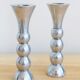 Pair of vintage cast aluminum candle holders