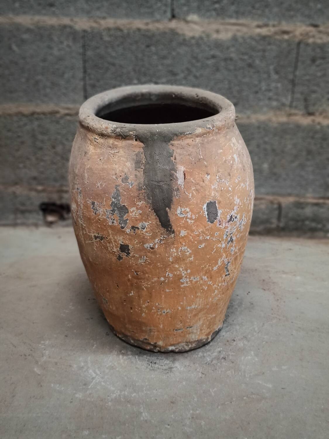 Old orange terracotta pot