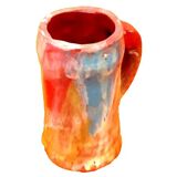 Traditional ceramic mug with a marbled glaze effect.