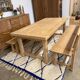 Solid oak extendable farmhouse table with 2 drawers.