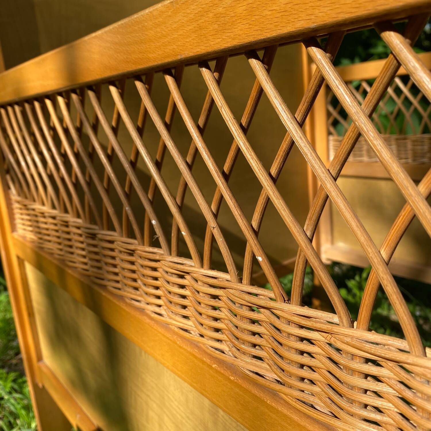 Vintage wooden and rattan baby cot from the 1960s.