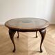 Louis XV coffee table in wood with decorative glass top.
