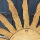 Miroir soleil en bois et stuc doré, années 50
