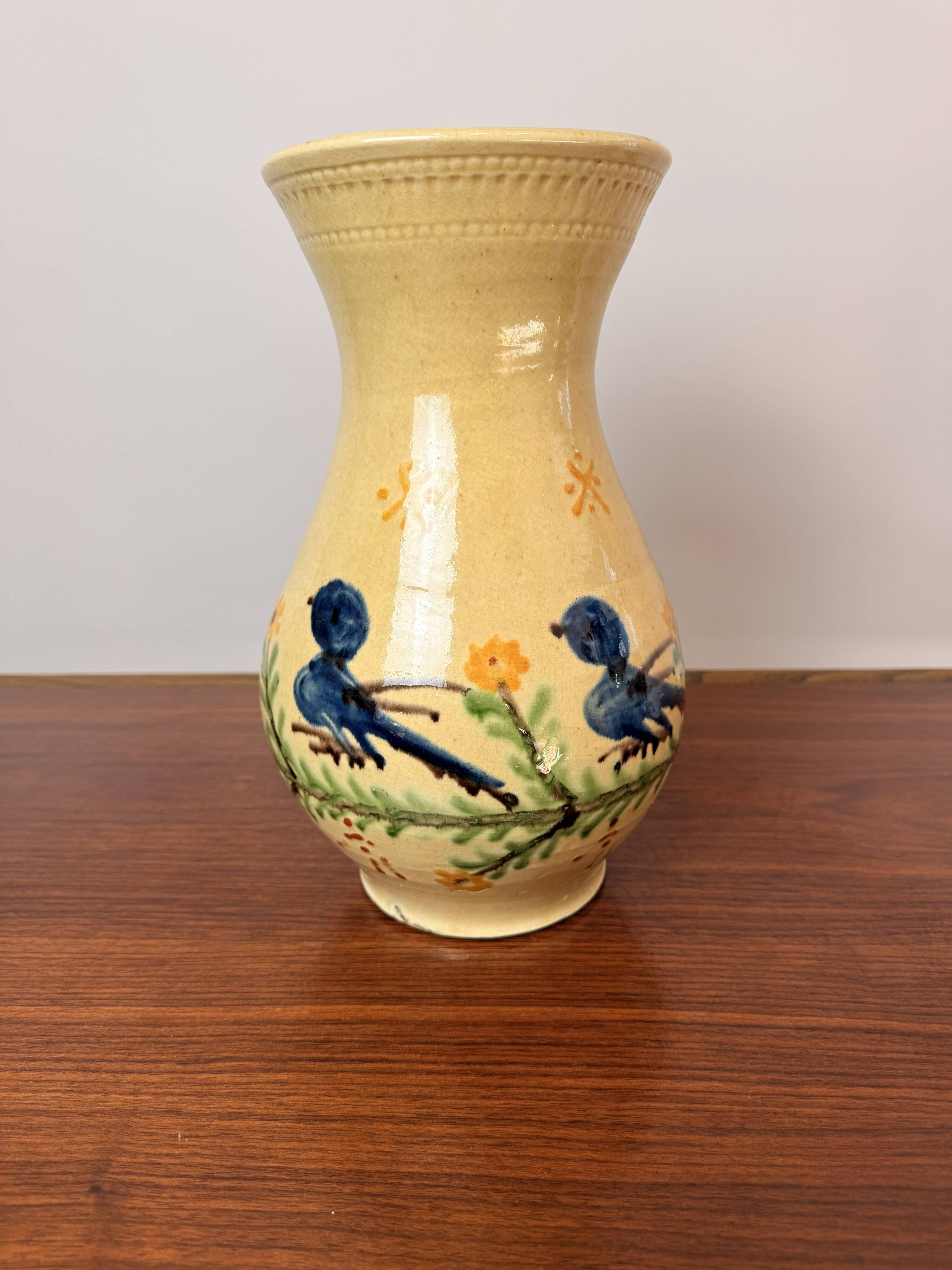 Large vase in glazed pottery decorated with blue birds and flowers.