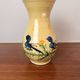 Large vase in glazed pottery decorated with blue birds and flowers.