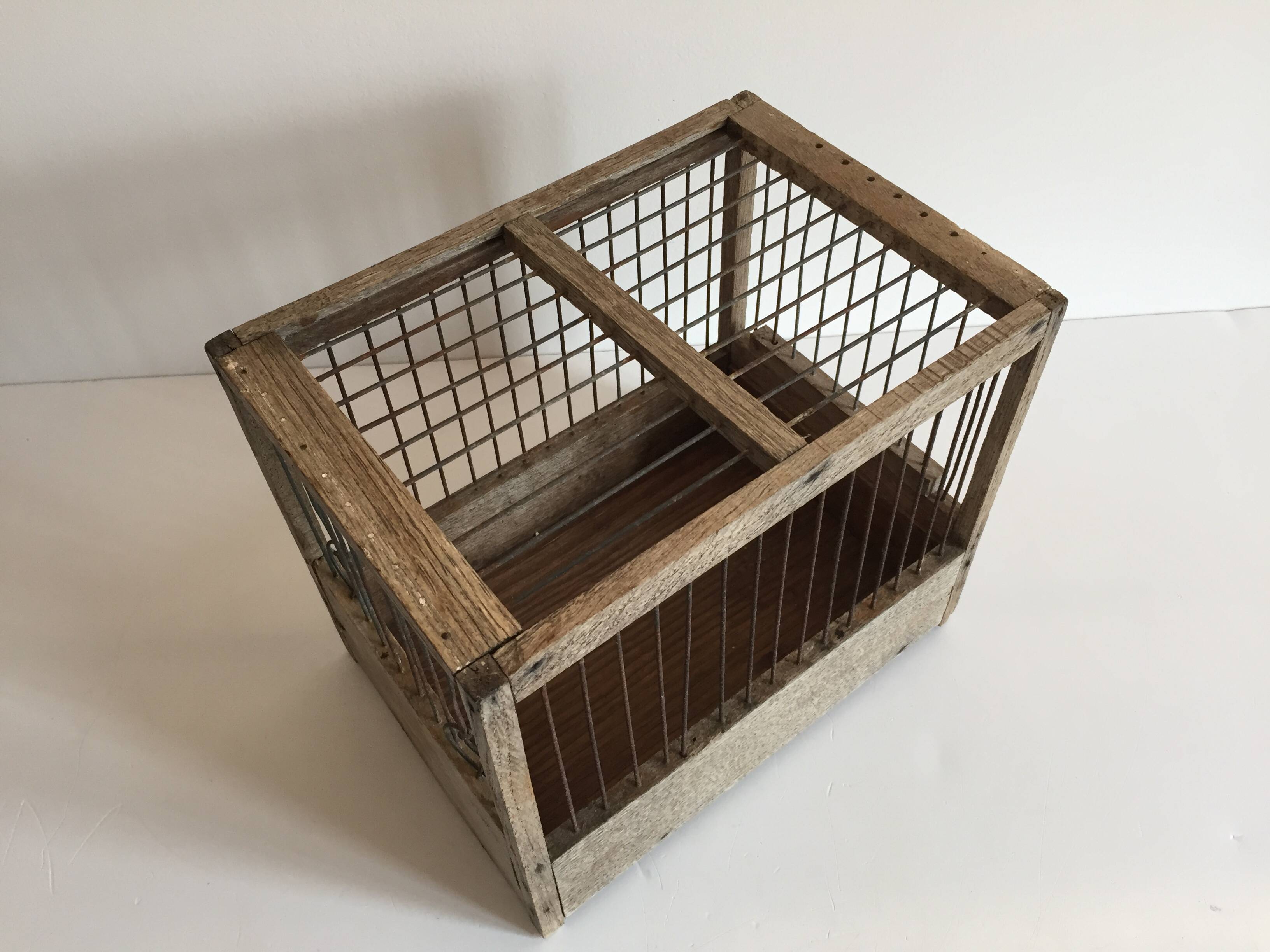 Old bird cage in wood and steel