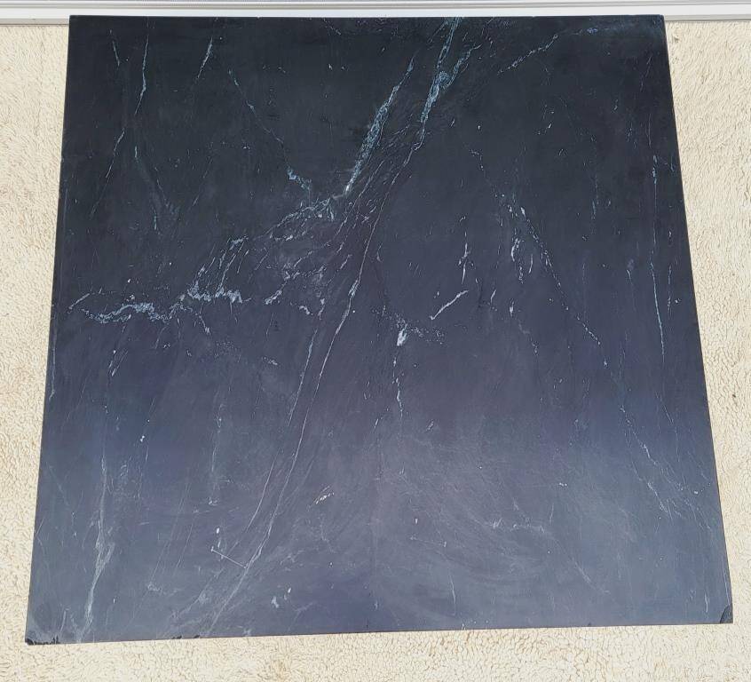 Coffee table or black marble and brass display "in its own juice"