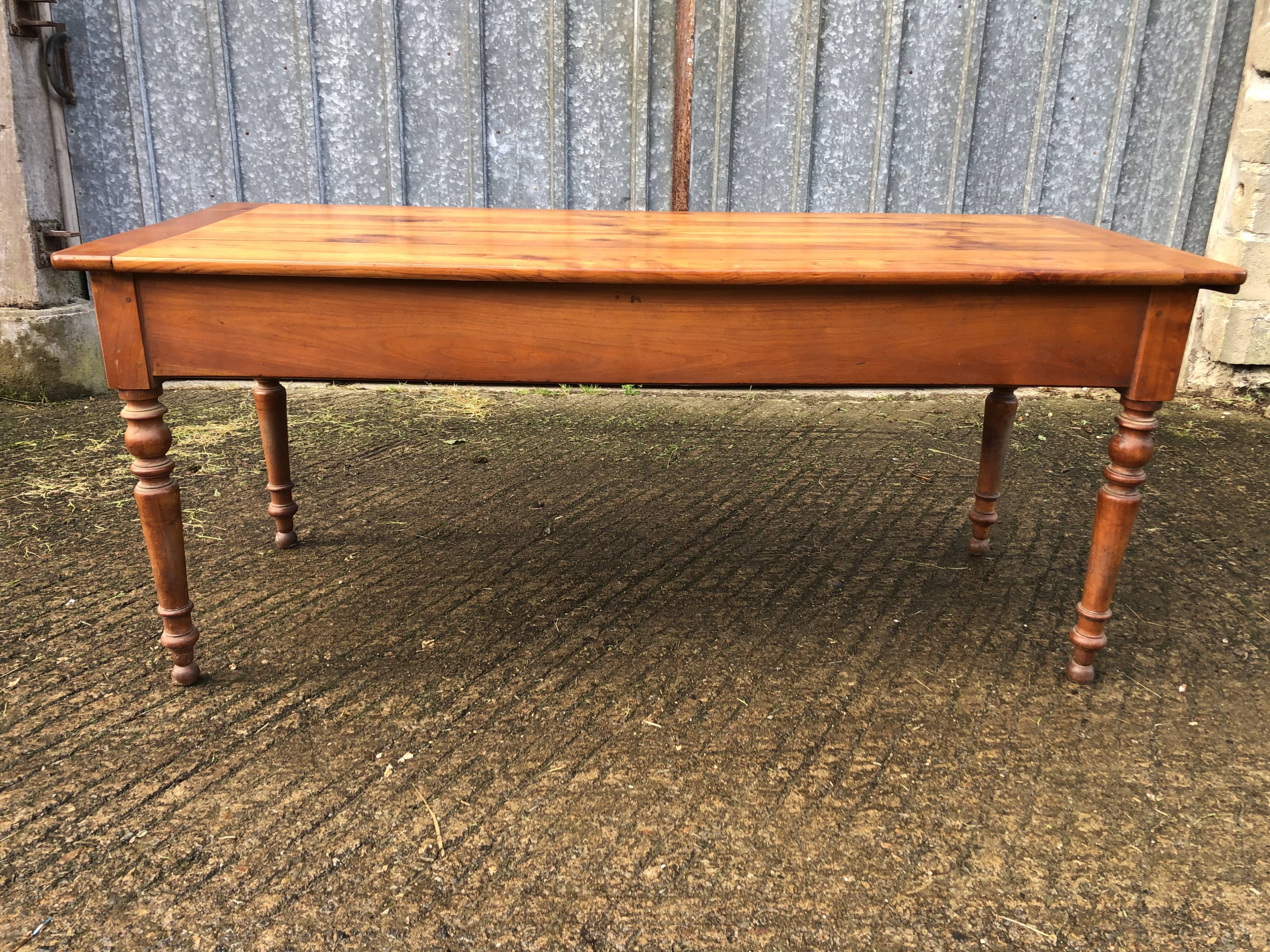 Antique farmhouse table in solid cherry wood in Louis Philippe style.