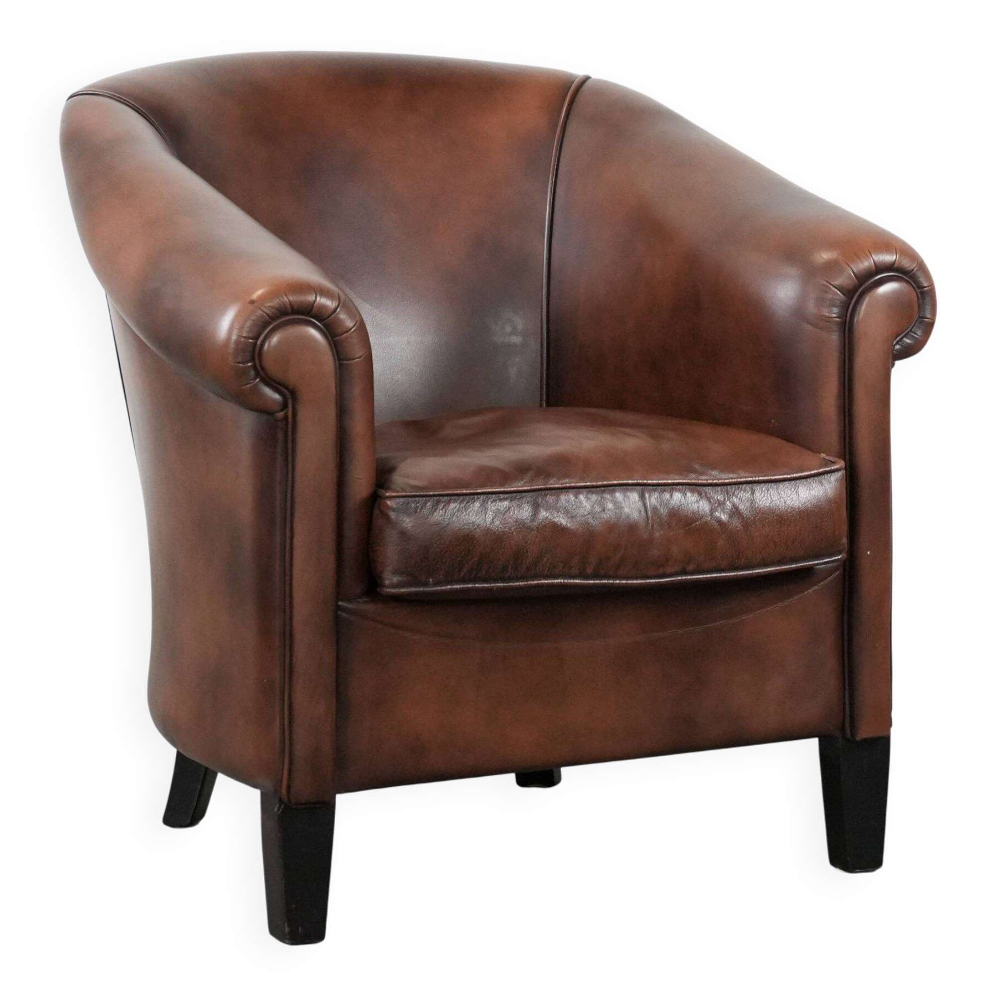 Great luxurious brown cowhide club armchair with matching piping
