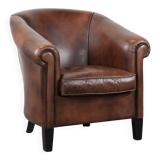 Great luxurious brown cowhide club armchair with matching piping