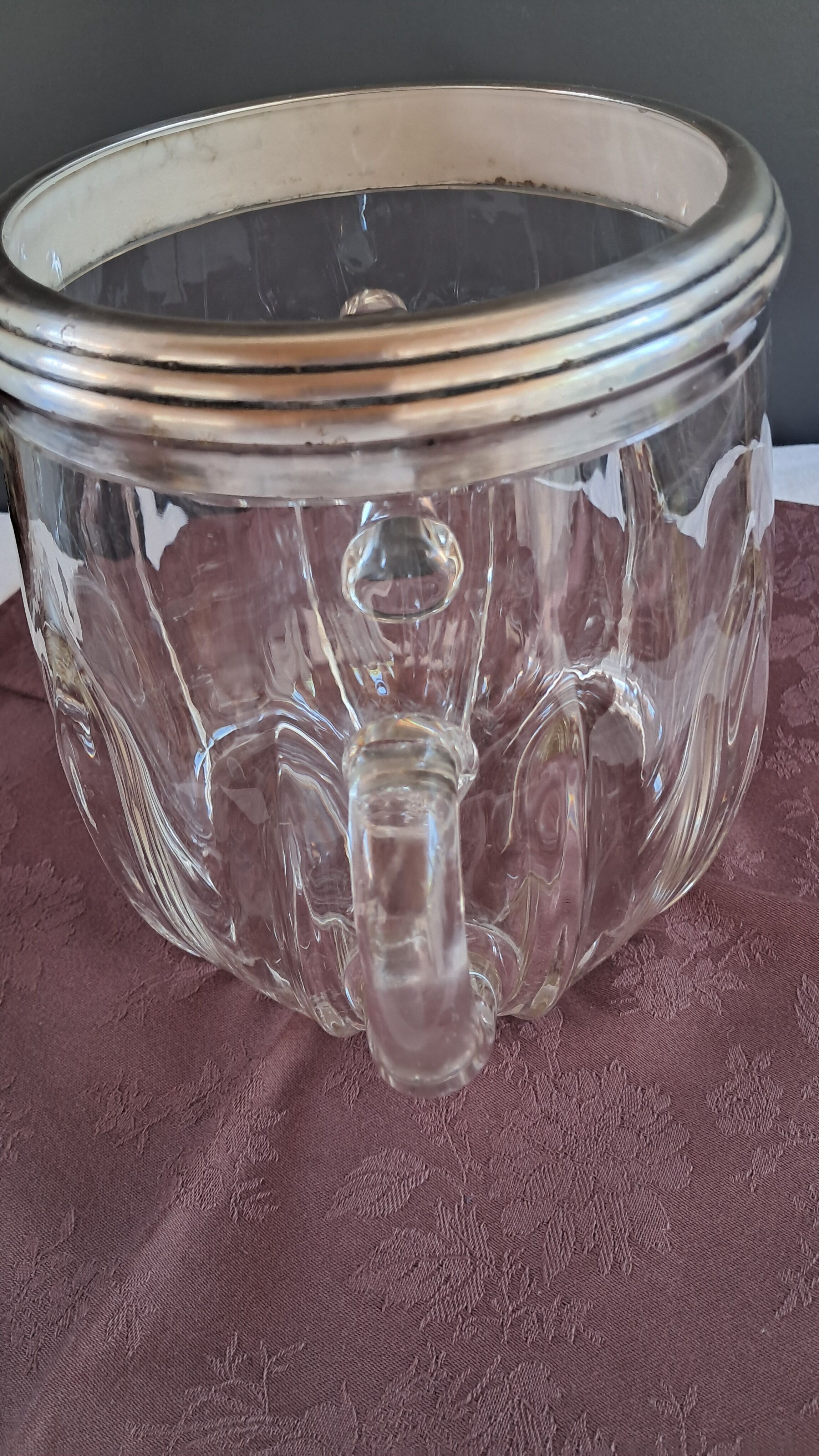 Twisted moulded glass bistro champagne bucket with a silver metal collar.