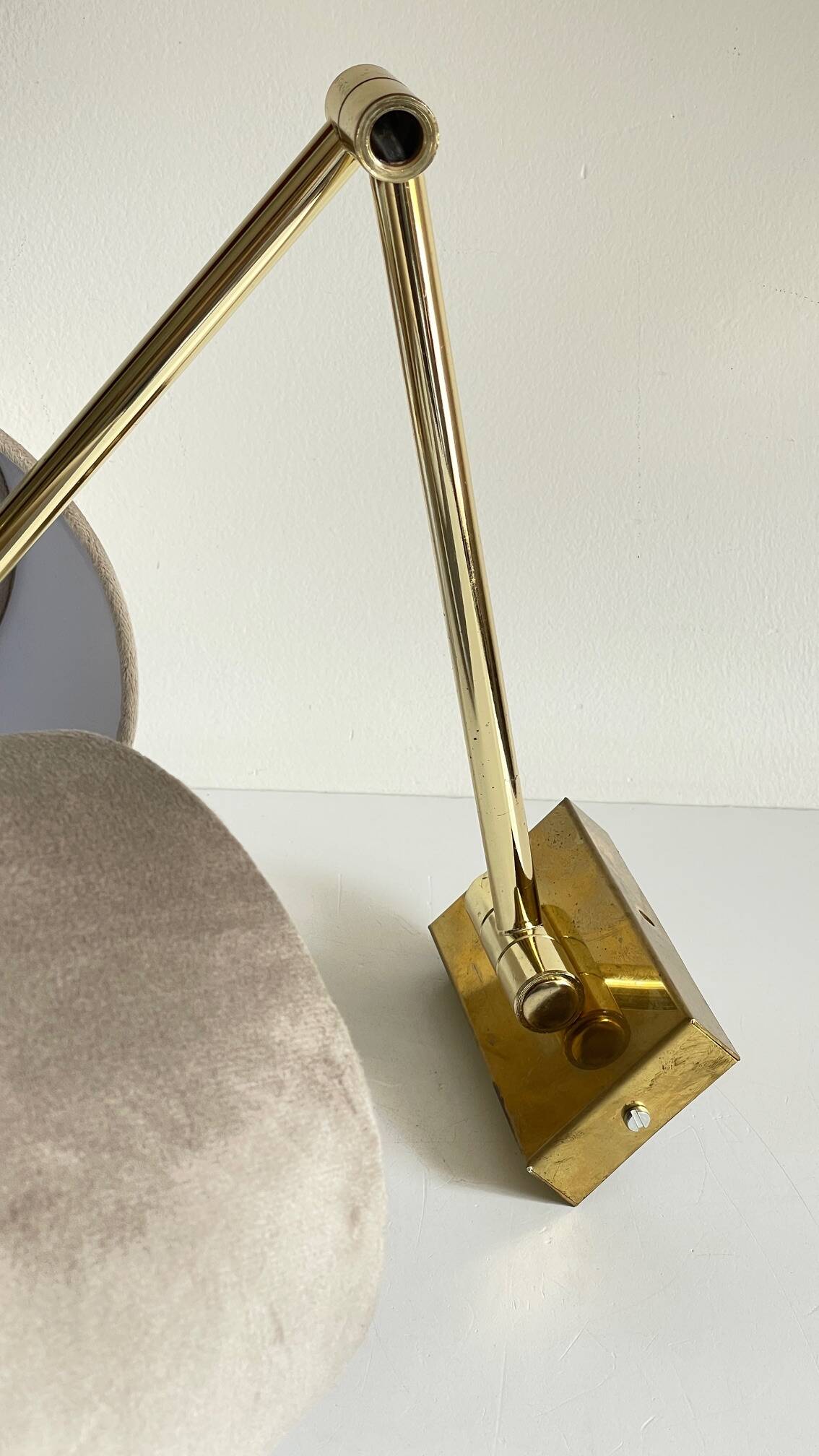 articulated brass and velvet wall light