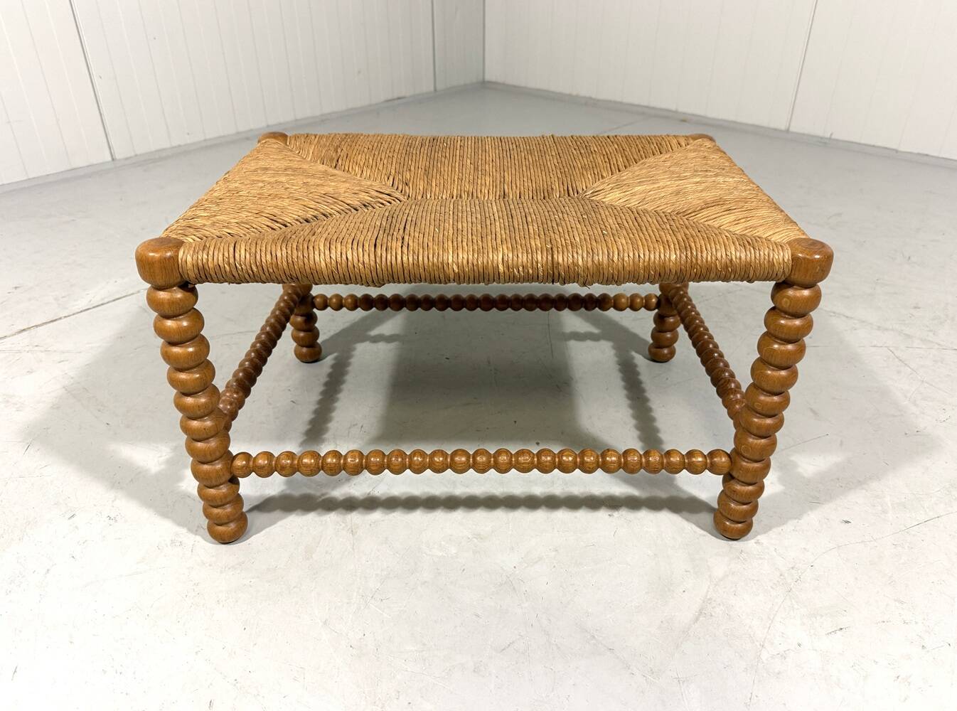 Low oak bobbin stool with rush seat 1930’s