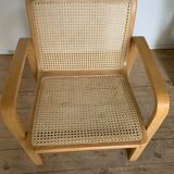 Vintage armchair in caning