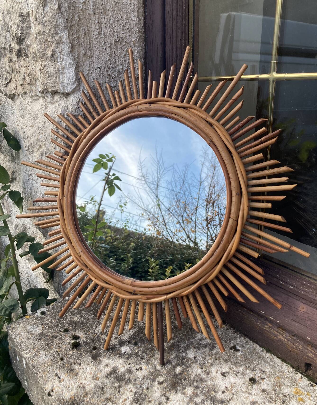 Vintage rattan sun mirror
