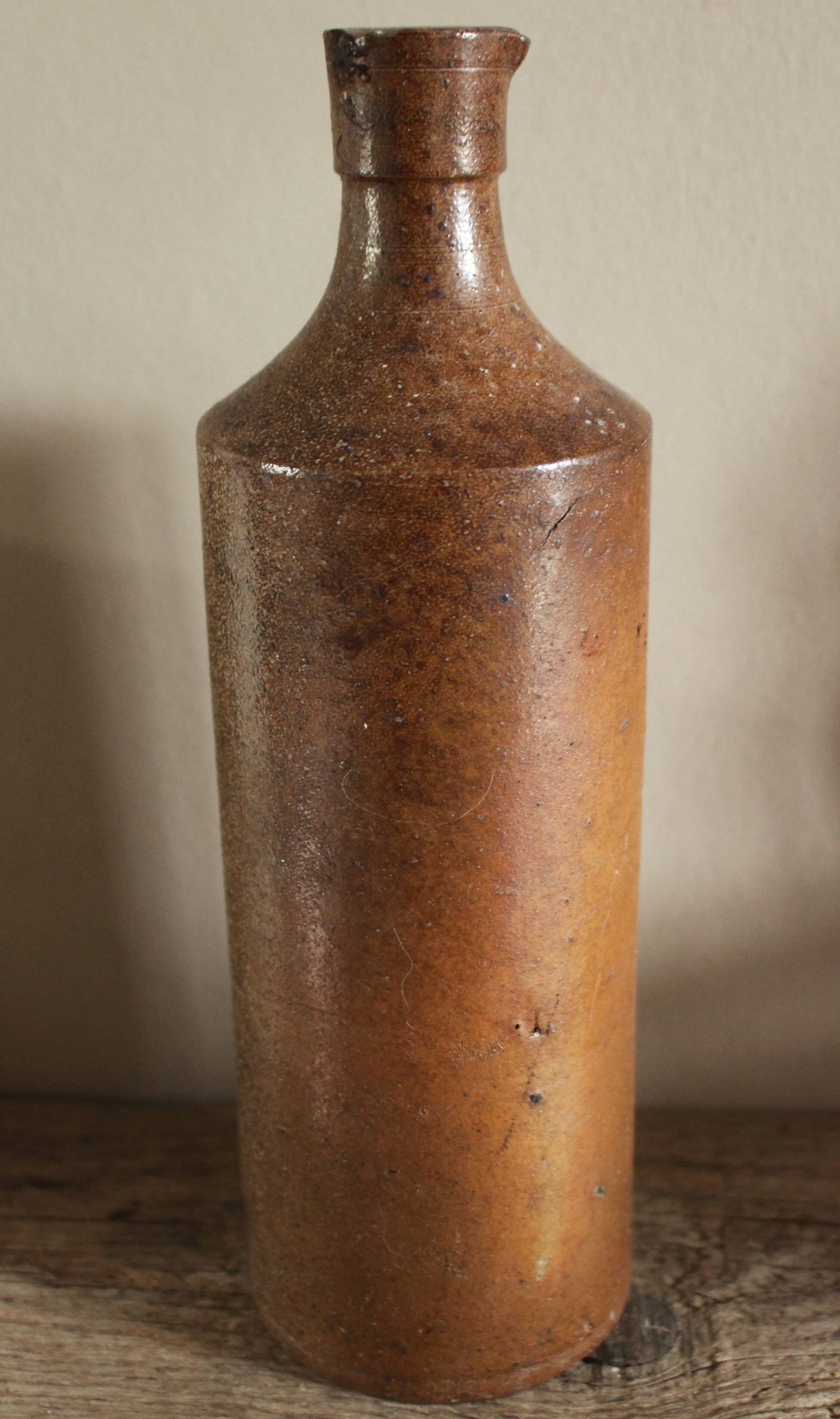 Vintage stoneware liqueur bottle with pouring spout