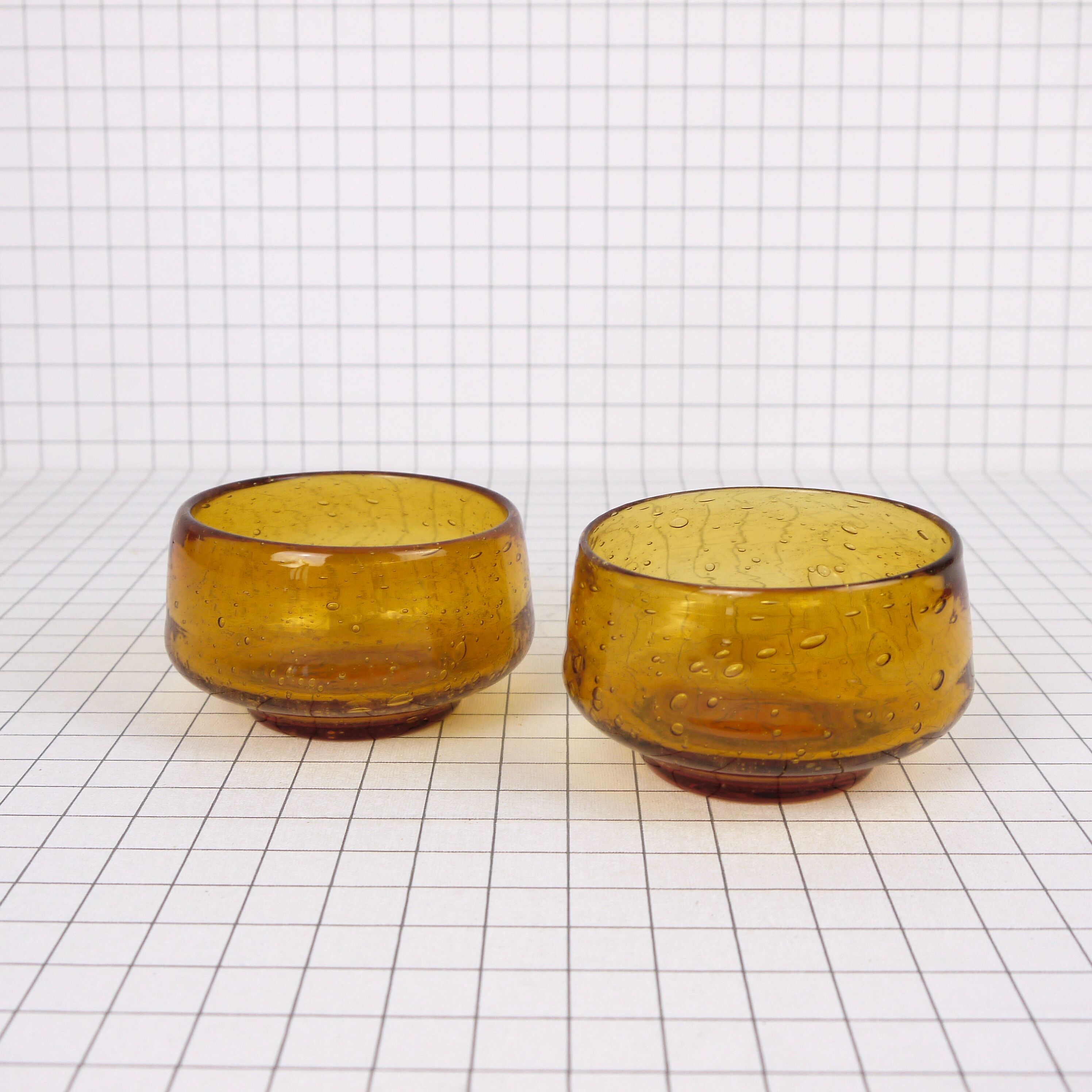 Two yellow bubble glass bowls