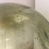 Old demijohn full of bubbles