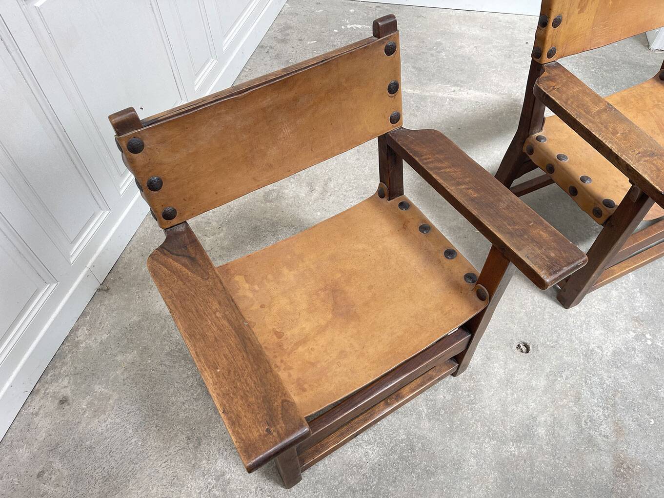 Pair of leather and walnut armchairs from the 1950s