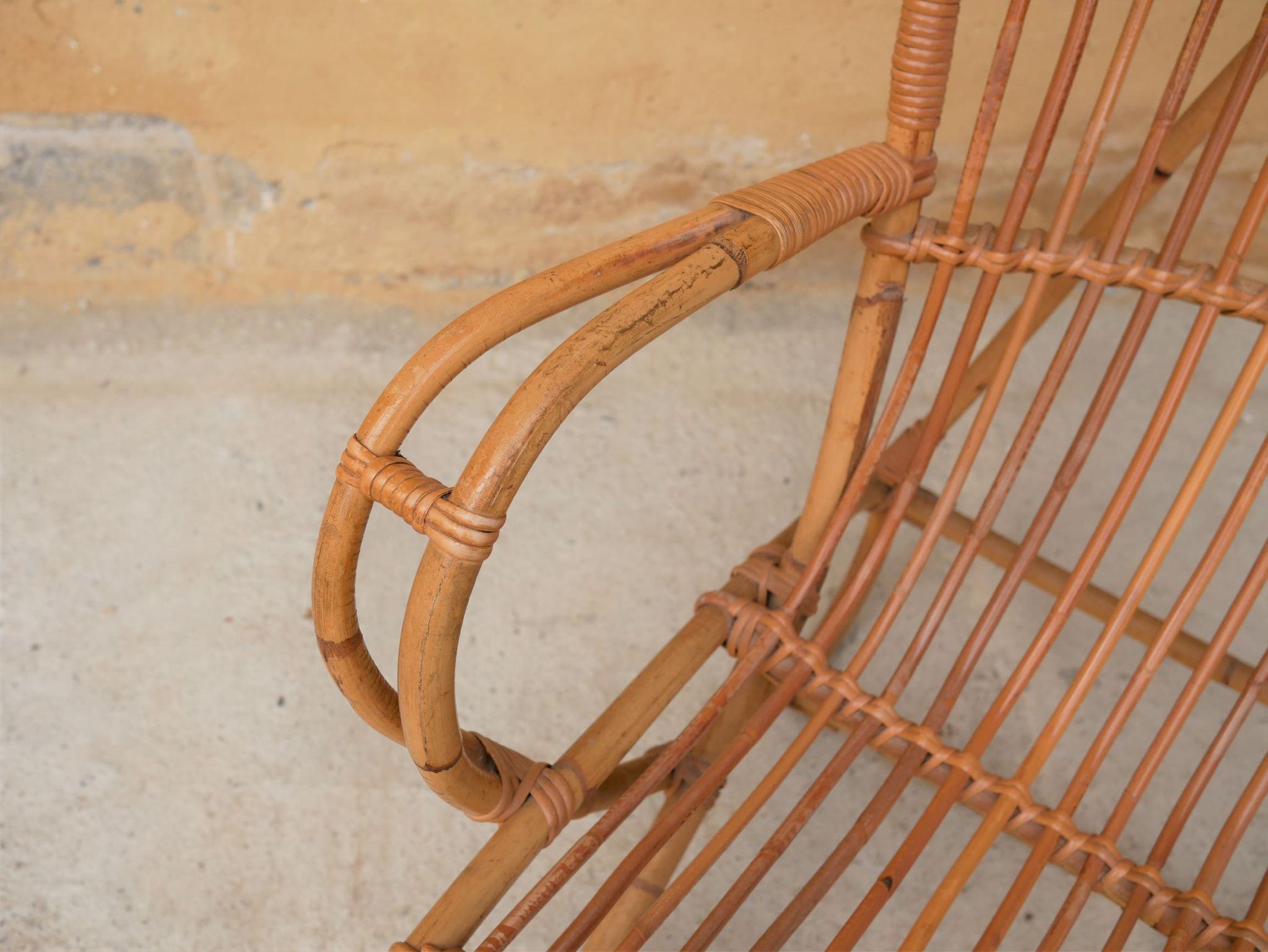 Vintage rattan chair by Louis Sognot