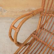 Vintage rattan chair by Louis Sognot