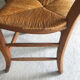 Round wooden table (4/6 people) with 4 straw chairs
