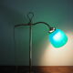 Desk lamp in brass with a swan neck and green opaline glass.