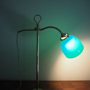 Desk lamp in brass with a swan neck and green opaline glass.