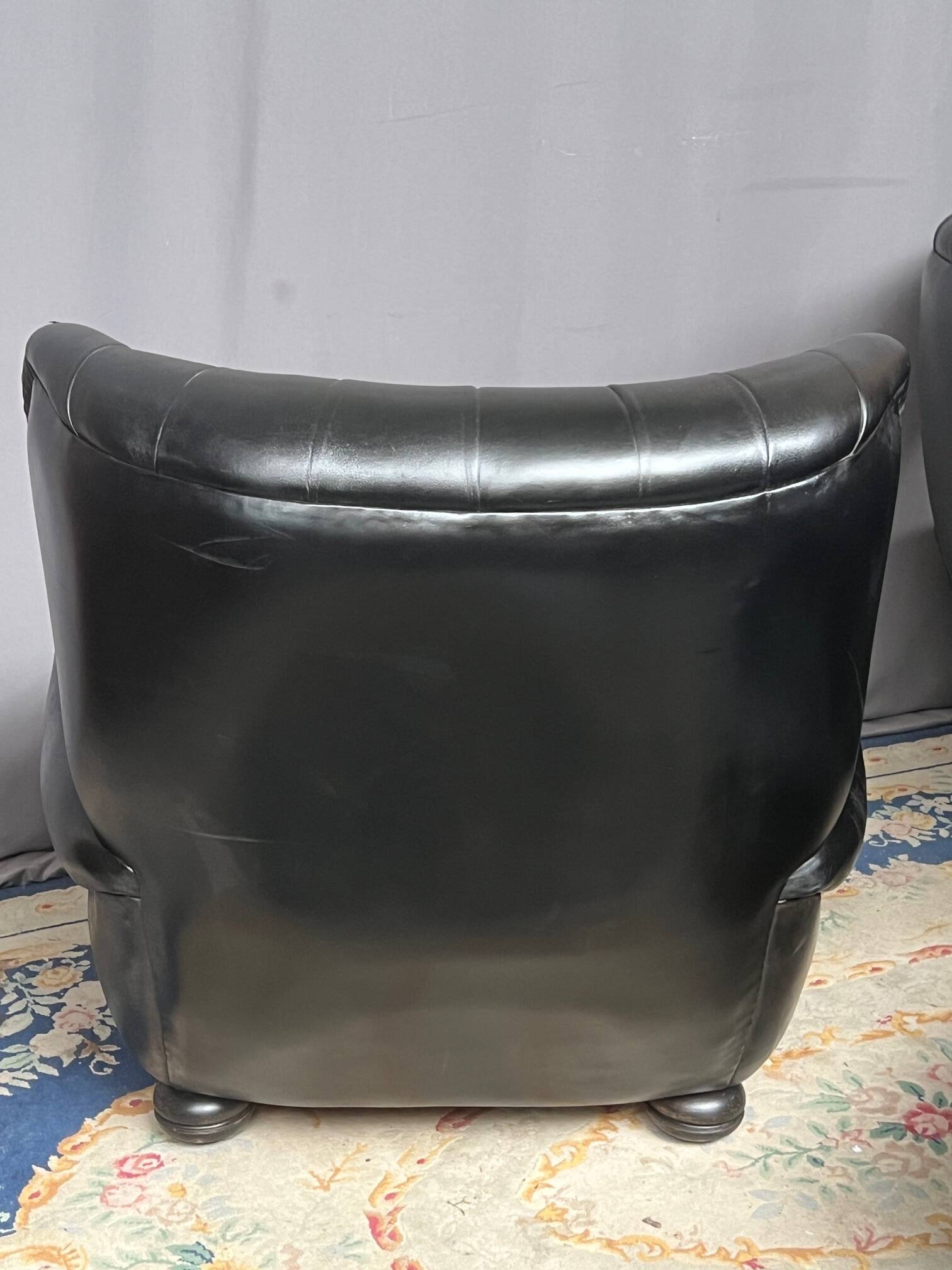 Chesterfield armchair and ottoman. Leather.