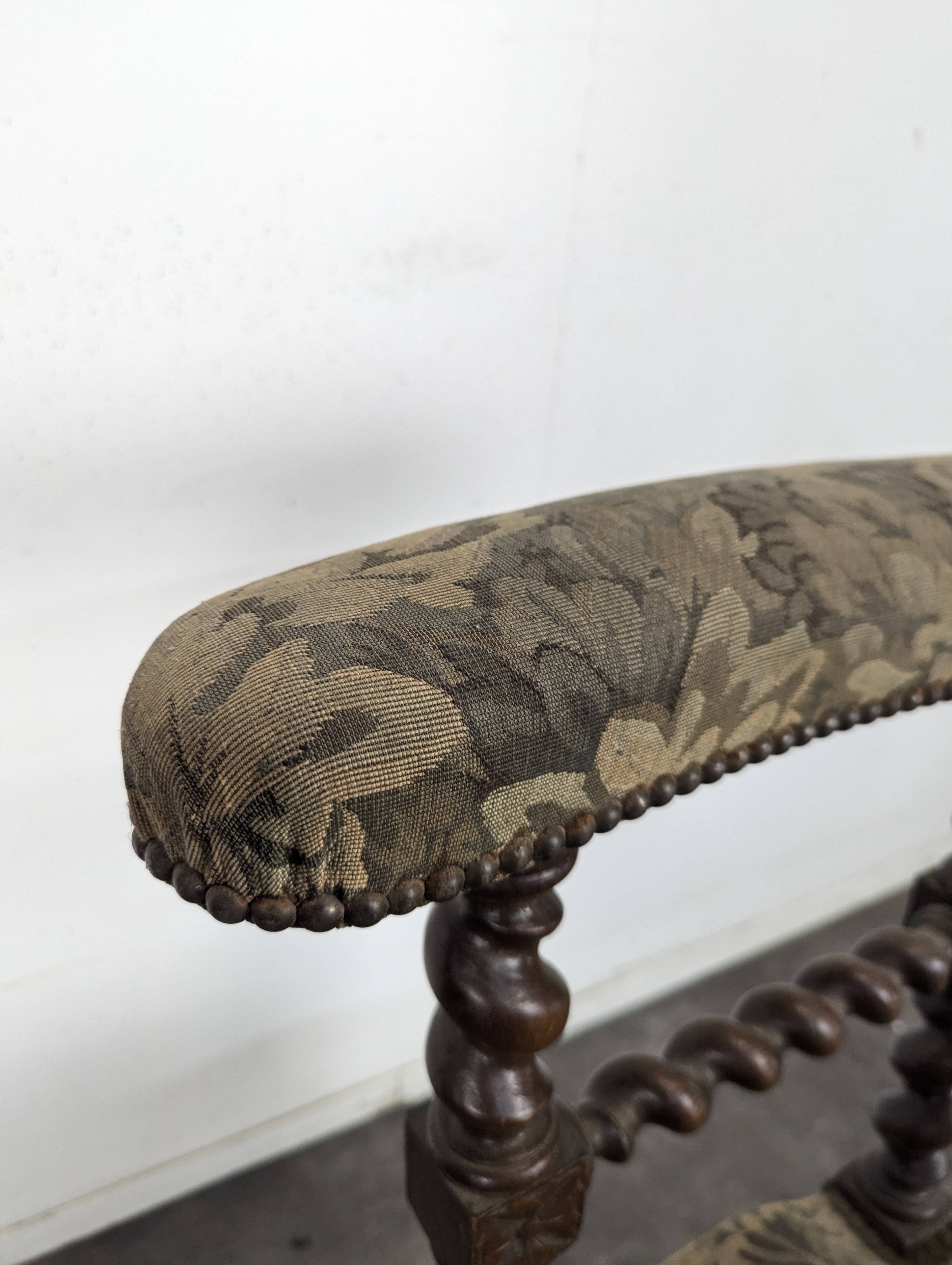 Napoleon III smoking chair in twisted blackened wood with foliage upholstery.