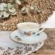 Natural soy wax candle and porcelain cup