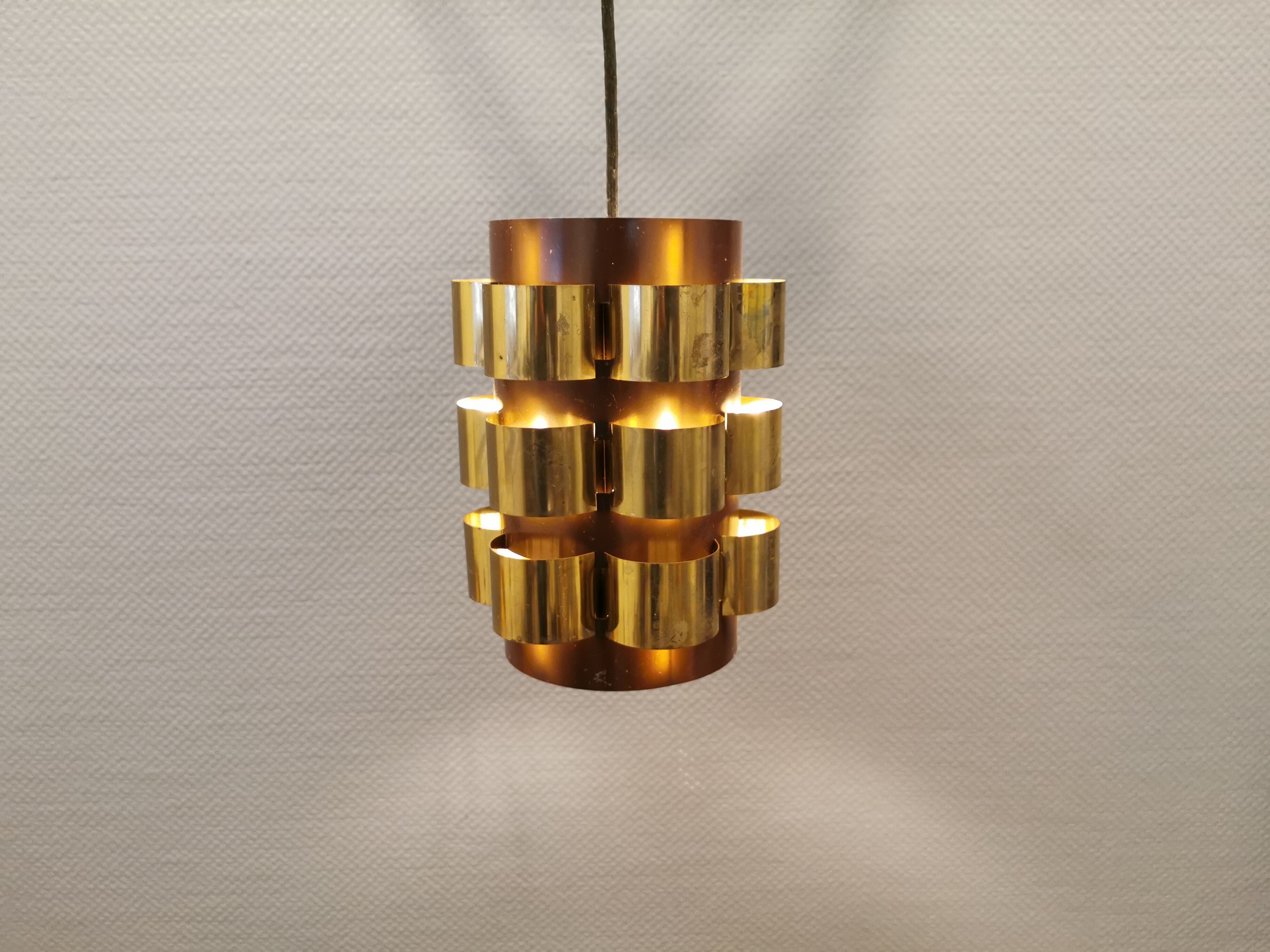 Danish hanging lamp from the 70s, in thin cut metal.