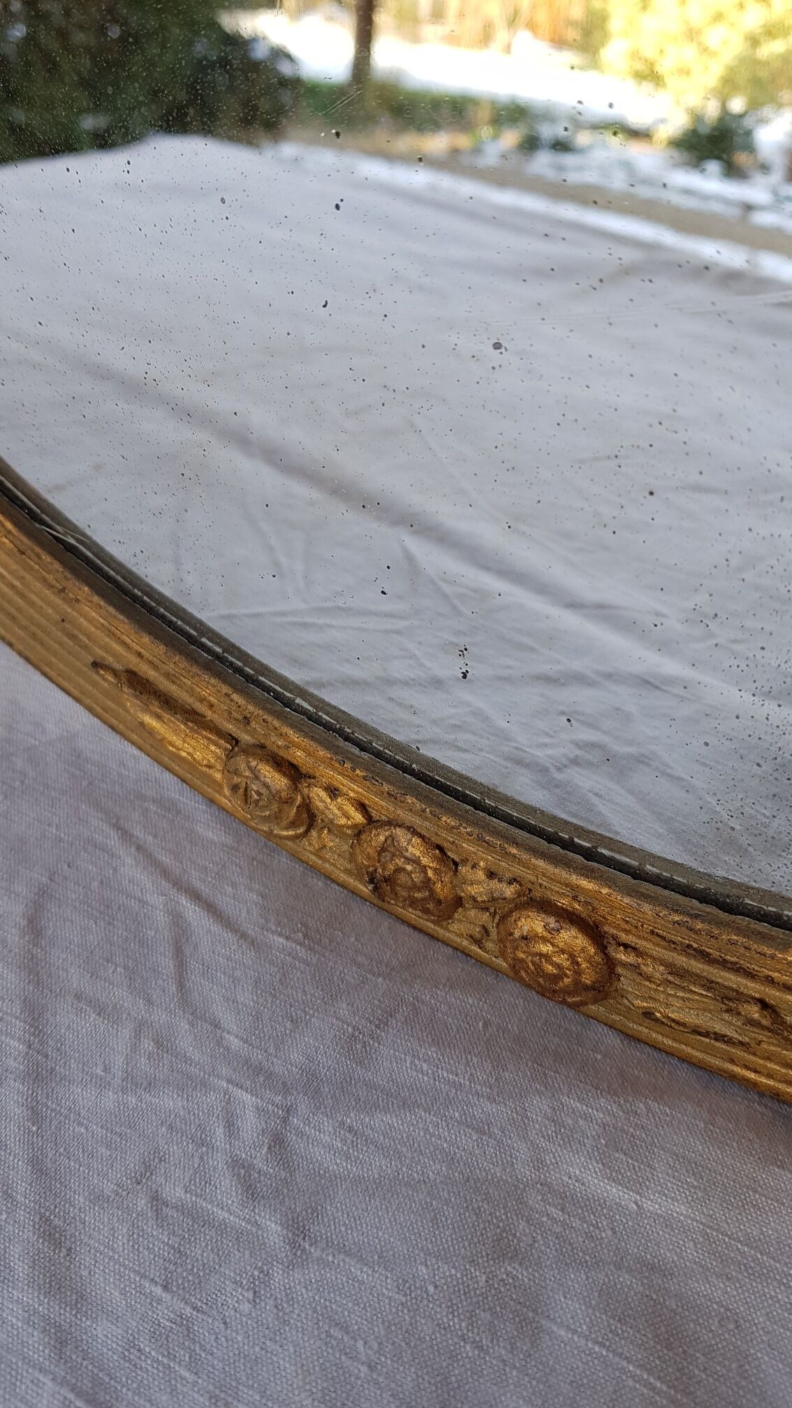 Art Deco golden oval mirror